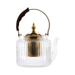 Clear glass teapot with a wood 